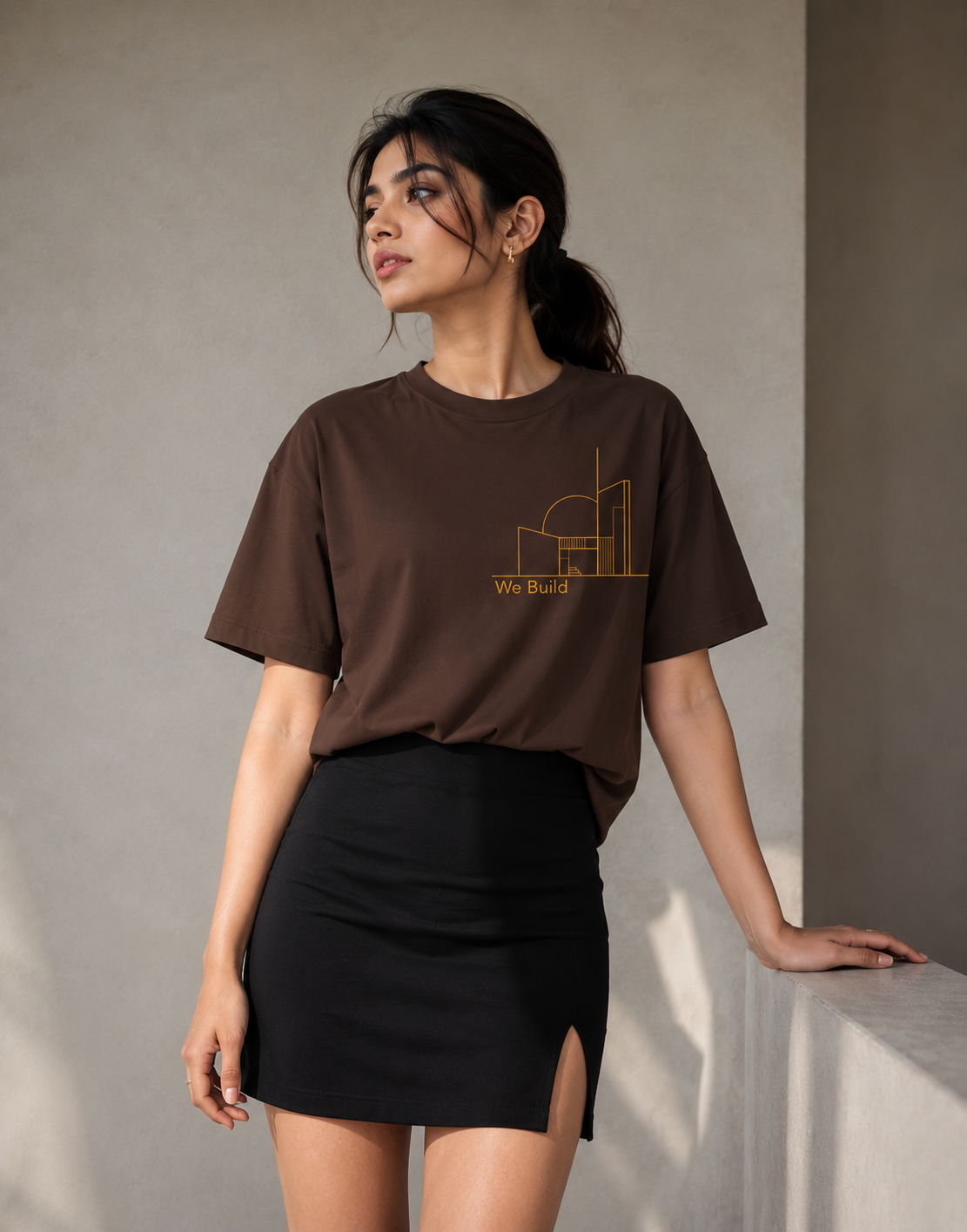 Luxury streetwear oversized brown graphic T-shirt on female model