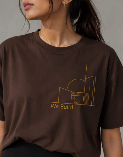 Woman styling minimal architecture oversized T-shirt with black skirt