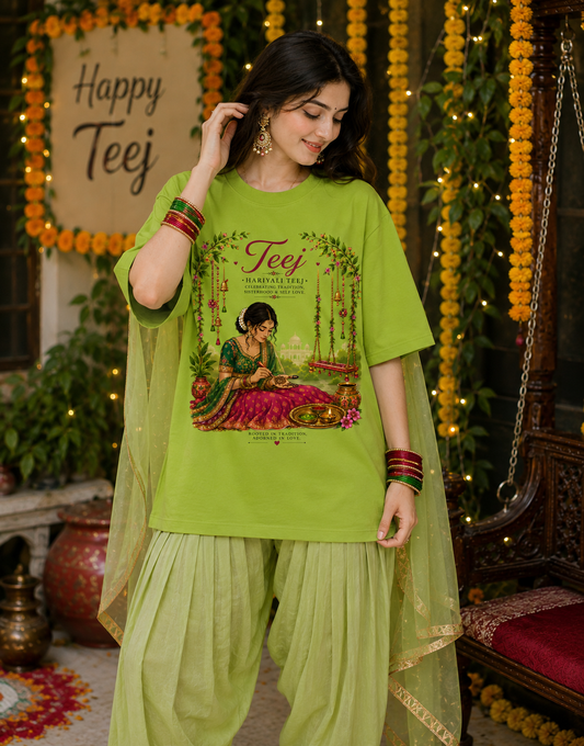 Green oversized Hariyali Teej graphic T-shirt featuring Indian woman applying mehndi festive artwork by DORENIQUE