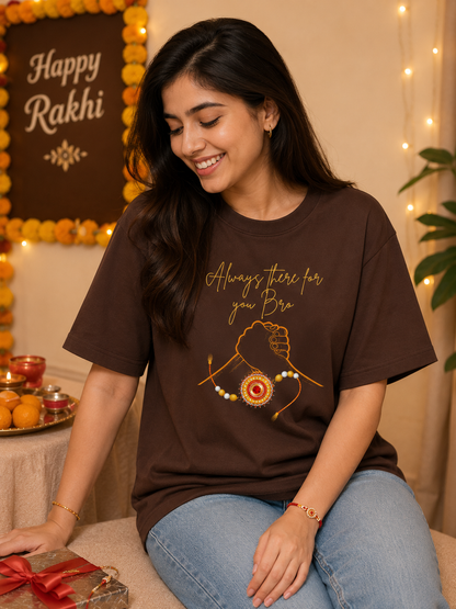 Woman wearing chocolate brown oversized Raksha Bandhan T-shirt for sisters featuring Always There For You Bro graphic