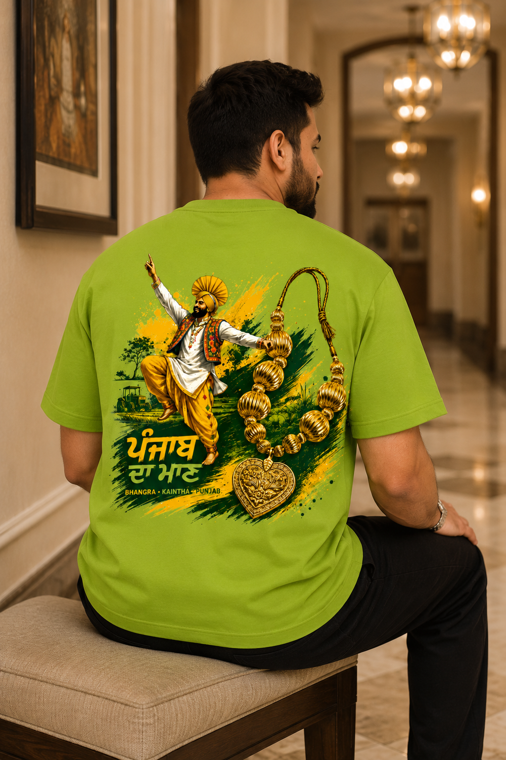 Back graphic of Bhangra Kaintha Punjab oversized green t-shirt featuring Punjabi dancer and traditional Kaintha jewellery