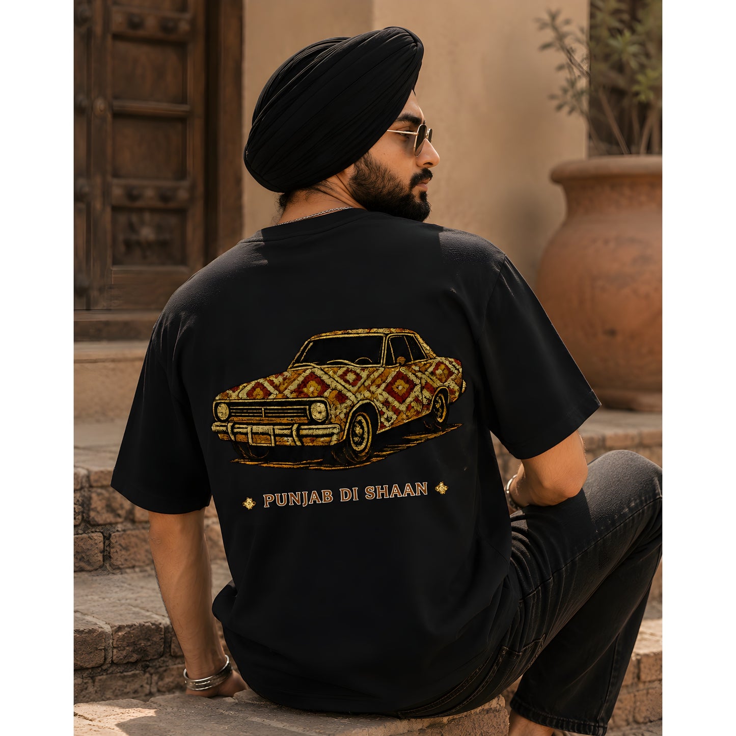 Black oversized Punjabi graphic tee with Phulkari inspired design